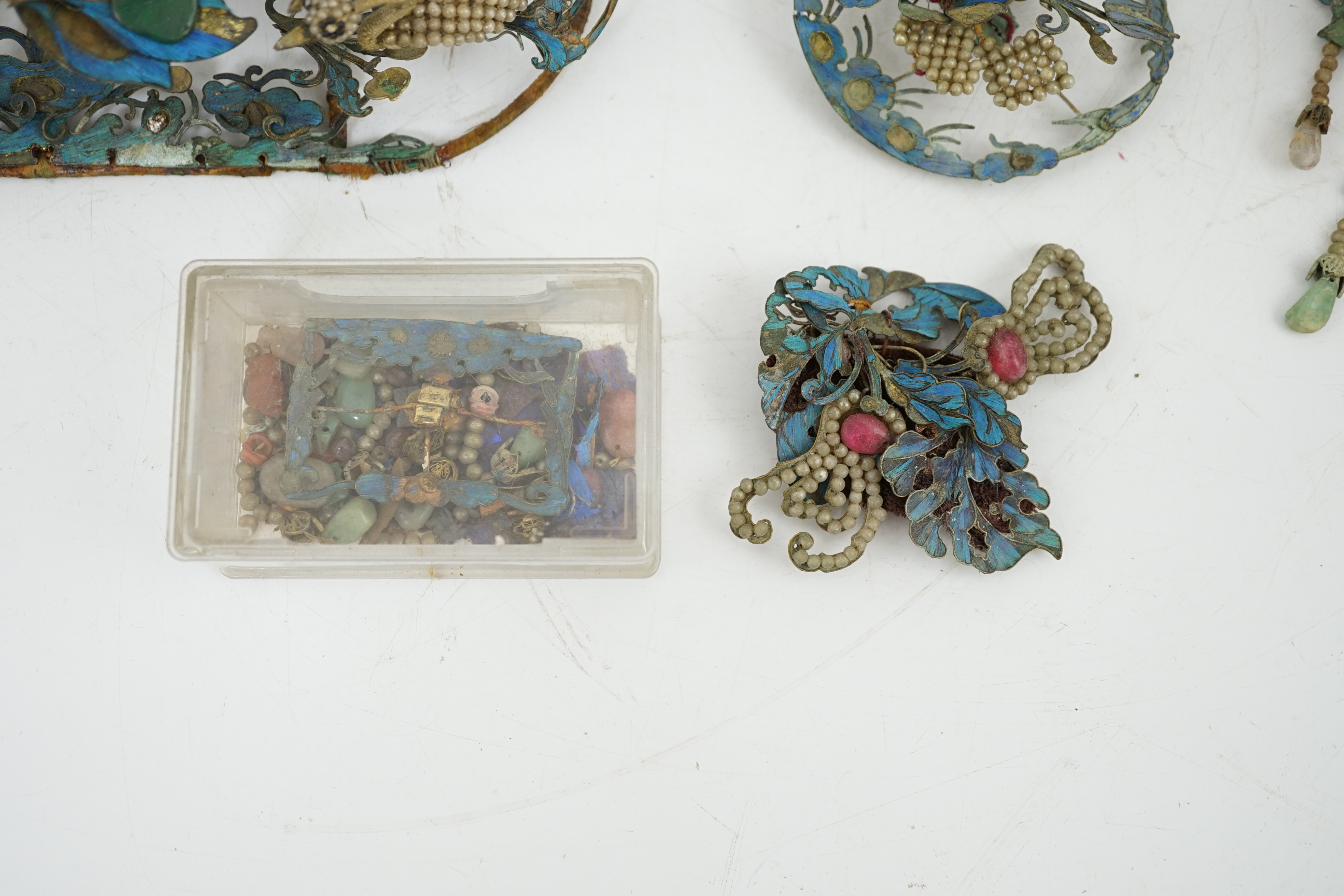 A group of eight Chinese kingfisher feather, jade, seed pearl, coral and hardstone mounted headdresses and ornaments, late Qing dynasty, some losses